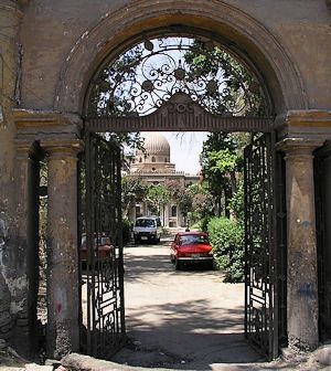A rusty portal, and behind an unknown gem in Cairo.